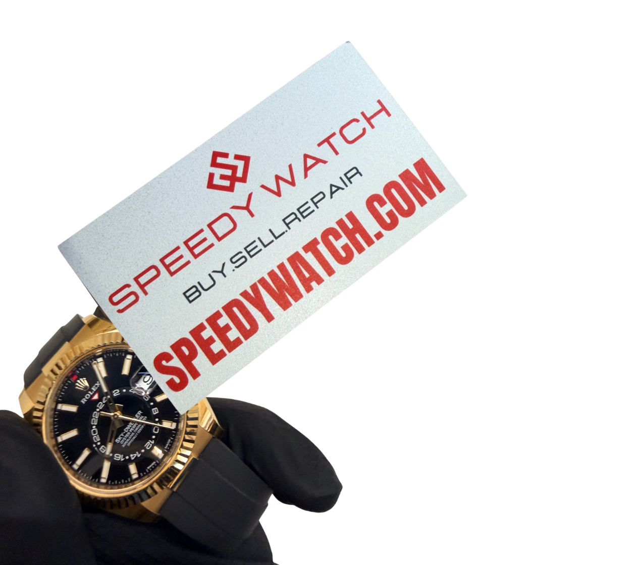 Gold wristwatch with black strap held by a gloved hand, attached to a tag reading 'SPEEDY WATCH.COM' and 'BUY SELL REPAIR'